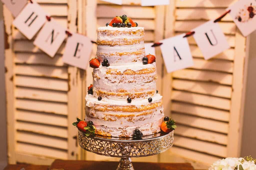 Wedding cake with berries and little frosting 