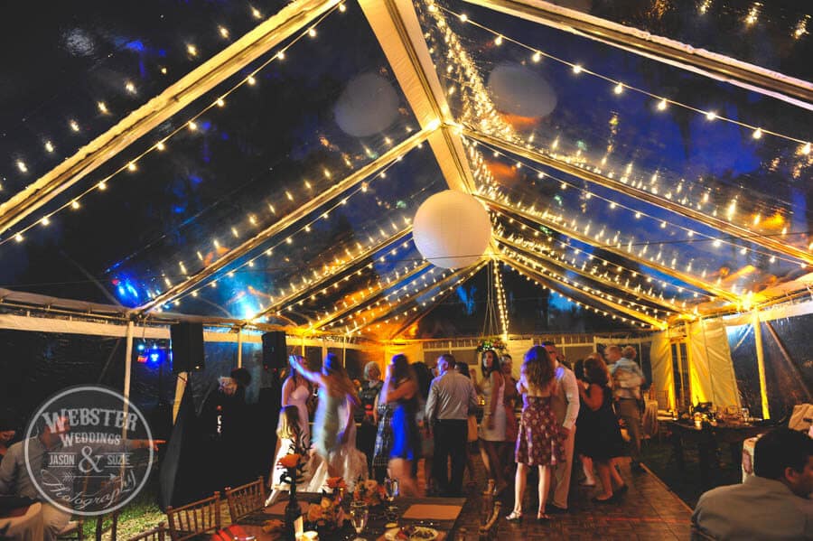 clear wedding tent with amber upligthing