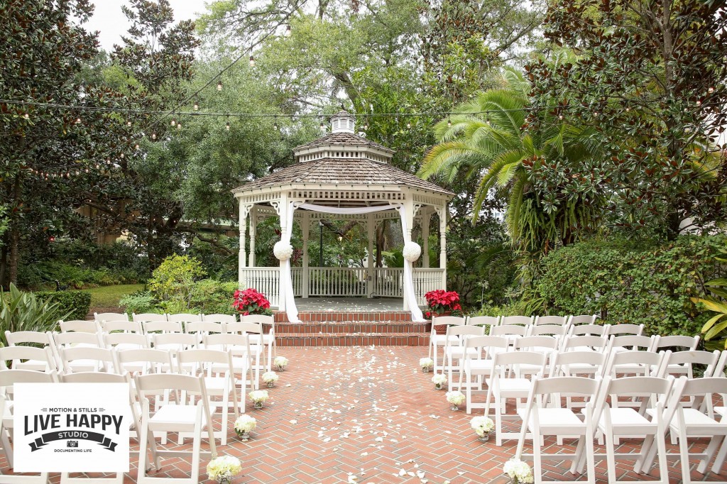 Lake Lucerne Outdoor Wedding ceremony set up with gazebo, white chairs, and red and white flowers
