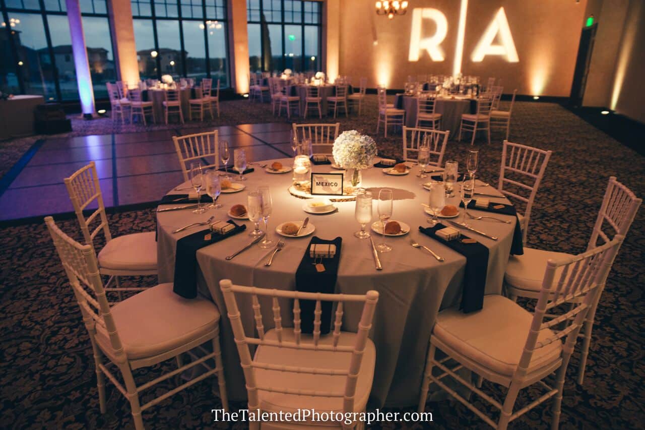 wedding dj in orlando at Bella Collina wedding reception table decor and room set up with upligting and gobo