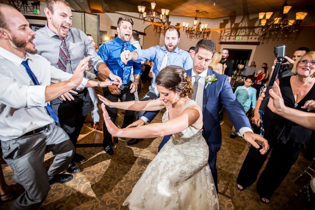 bride and groom dancing to the DJ's set list at a wedding