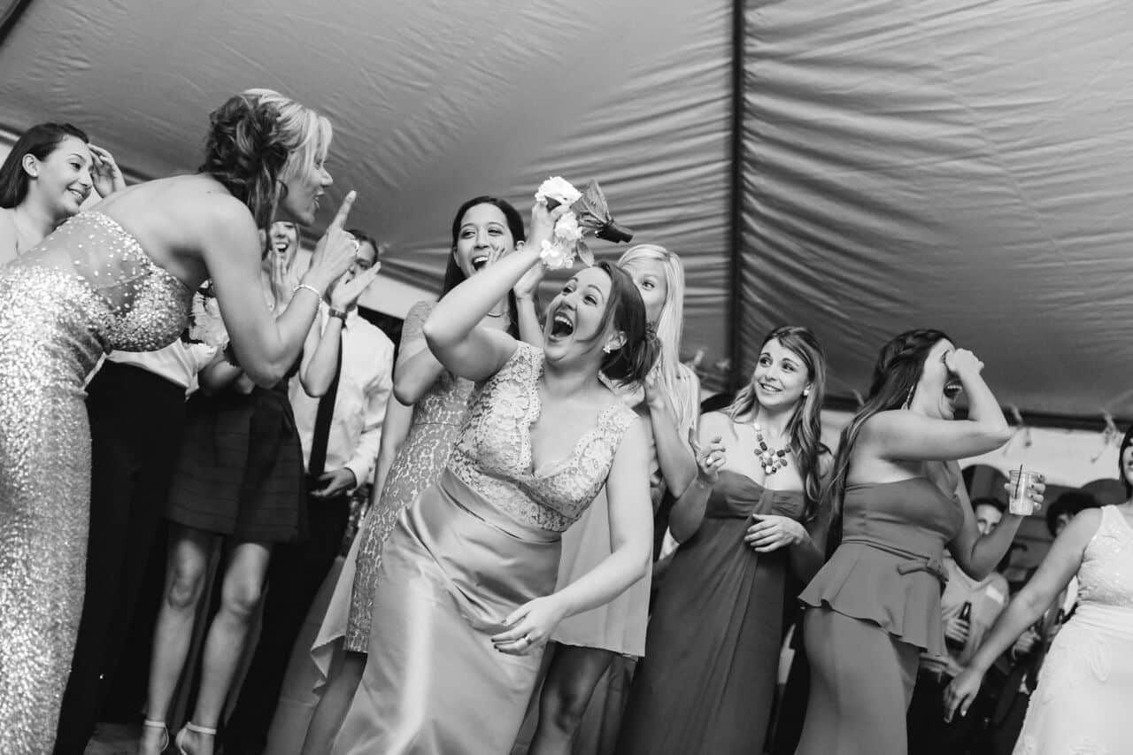 female dj at Veranda at Thornton Park wedding reception bouquet toss