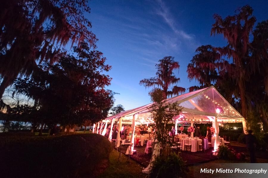 wedding dj fun at Cypress Grove Estate House wedding with pink uplighting in clear tent