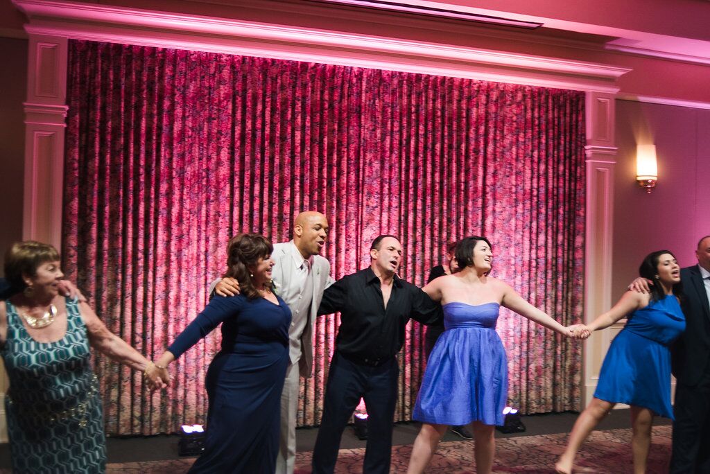 guests dance at leu gardens wedding with pink uplighting and dj in orlando