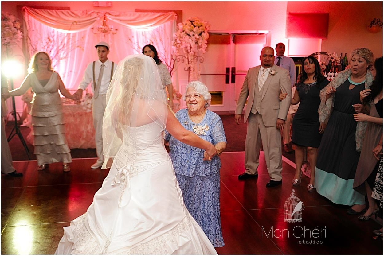 unique wedding vow renewal at the royal crest room bride dancing with mom