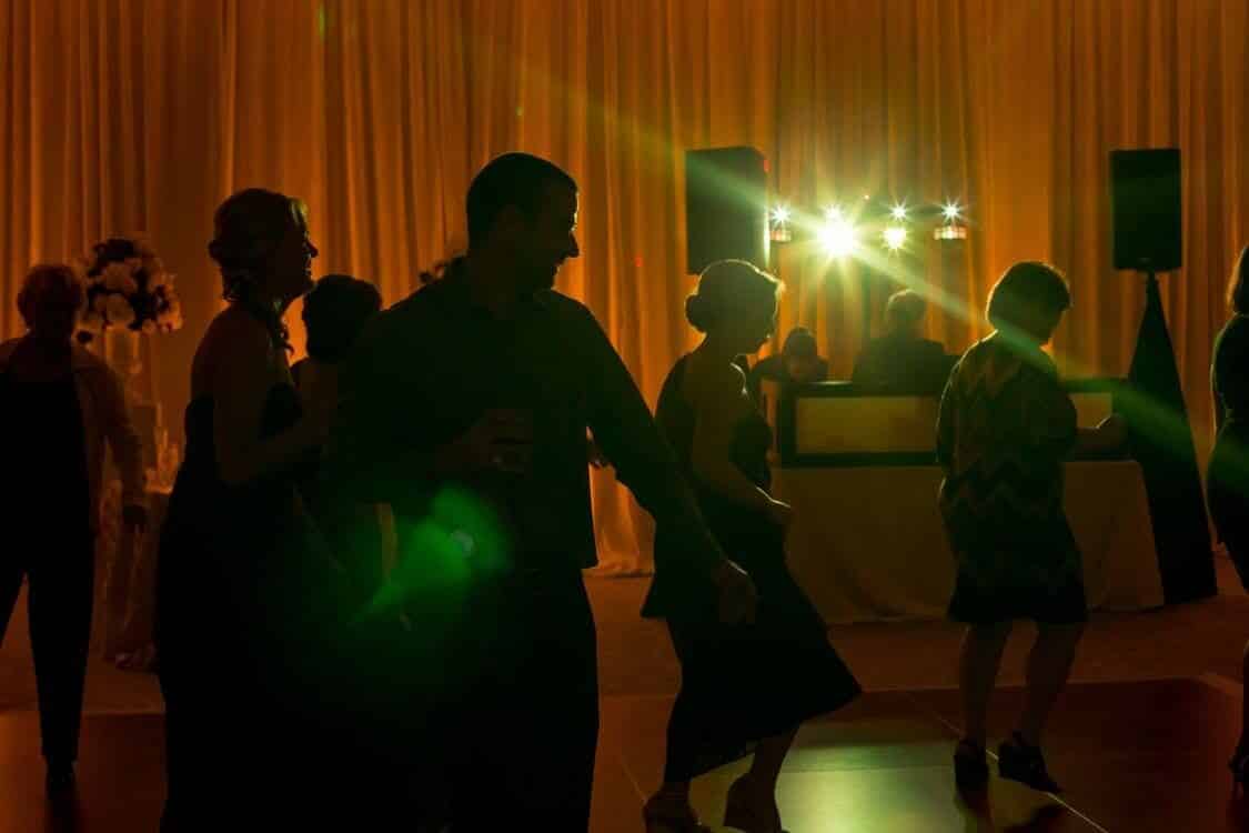 dancing on a cloud at Alfond Inn wedding reception dancing with amber uplighting and Our DJ Rocks