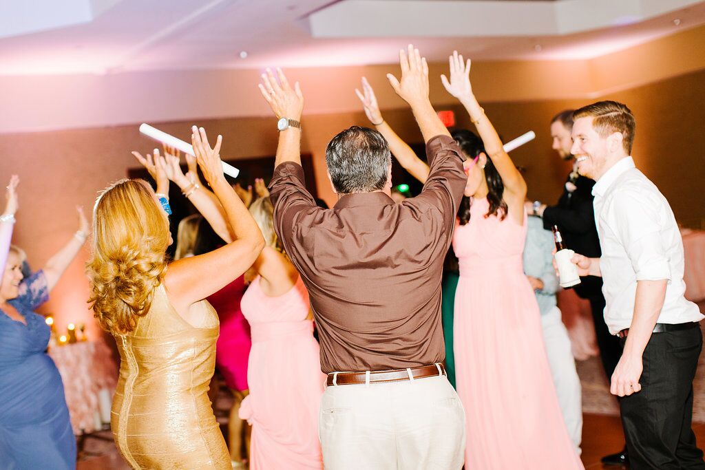 Villas of Grand Cypress Wedding reception dancing with blush pink uplighting 