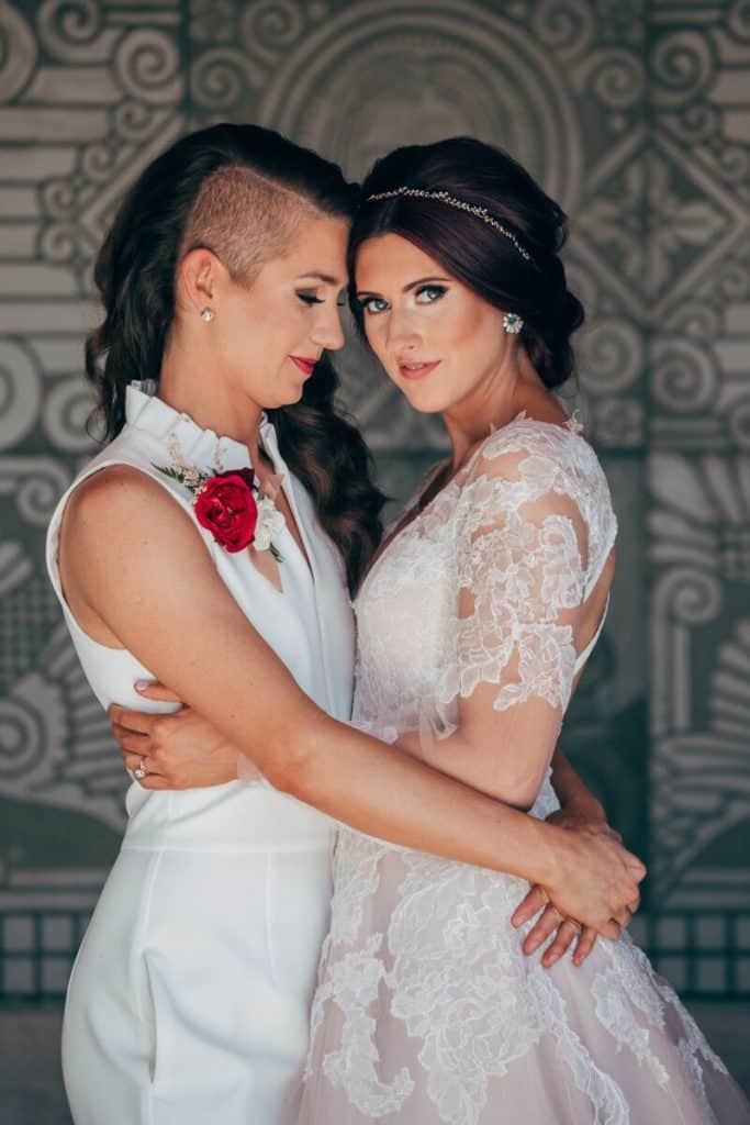 two brides in embrace