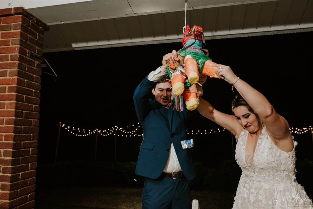 Bride and Groom ripping open pinata