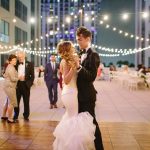 Tim + Brittany sharing intimate dance on beautiful rooftop venue