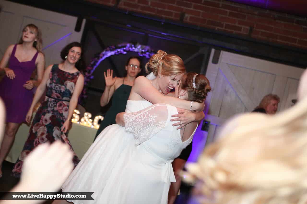 Happy brides smiling at each other