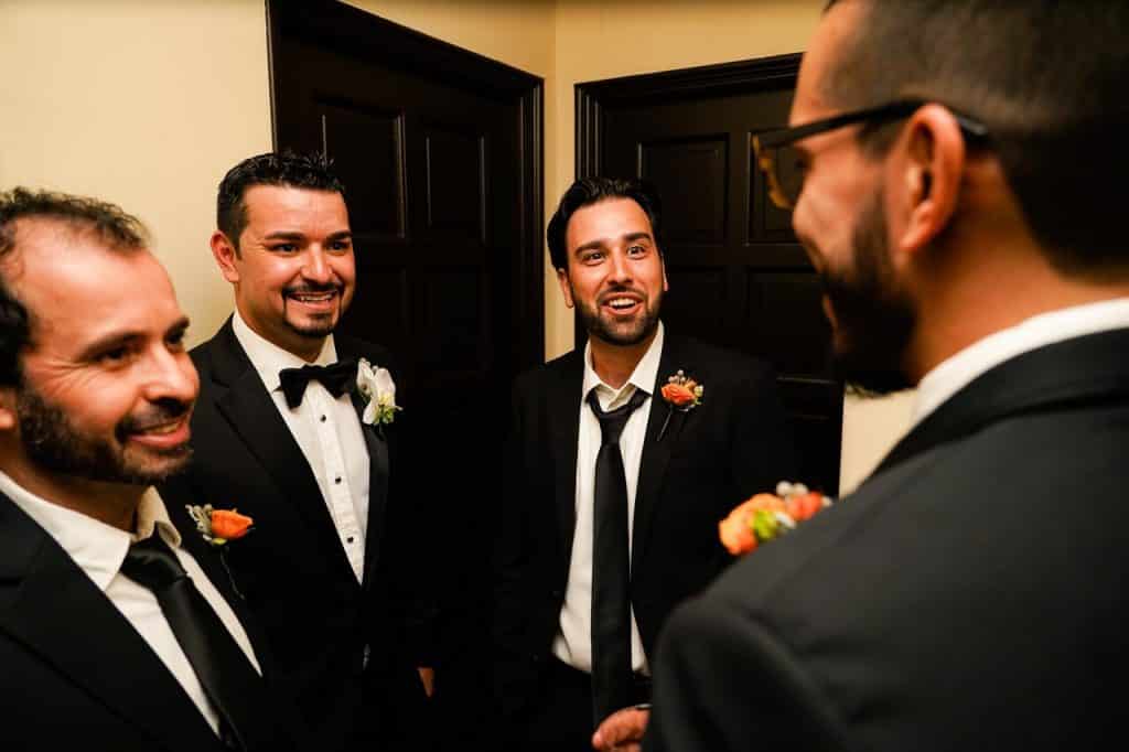 groom and groomsmen in hallway