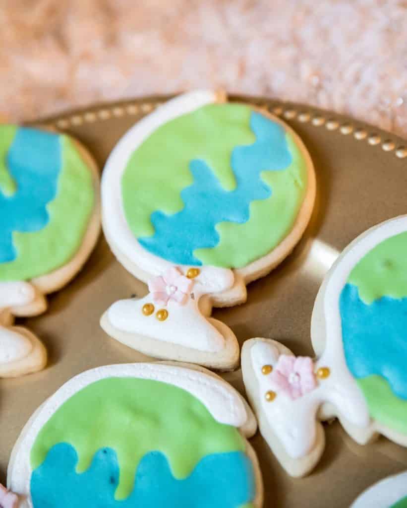 globe-shaped cookies at wedding dessert table