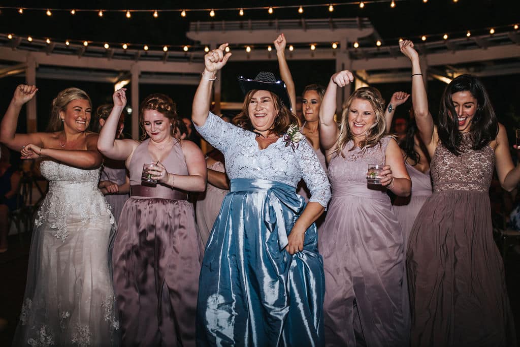 Albina dancing with her mom and bridesmaids.