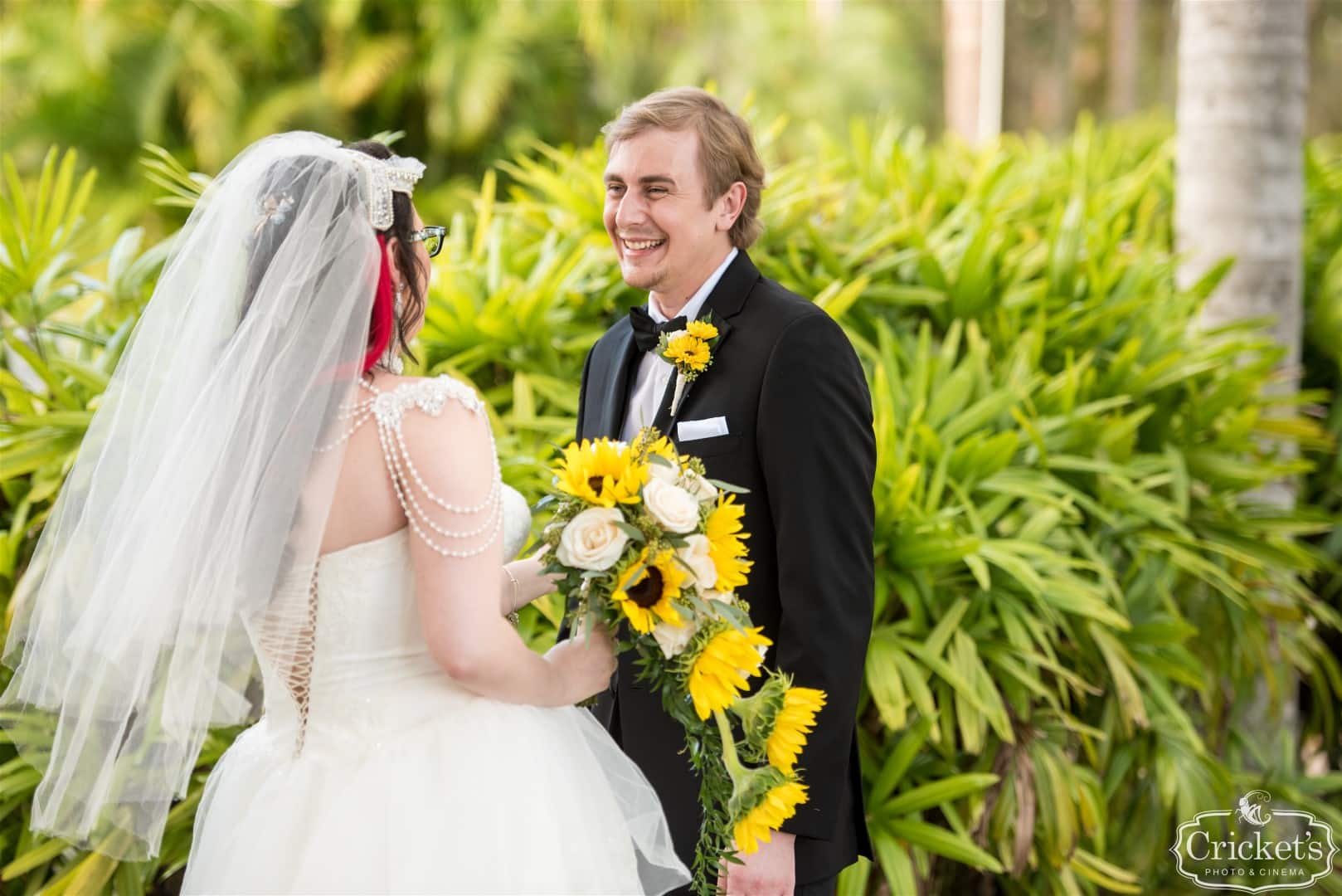 bride and groom laughing at each other