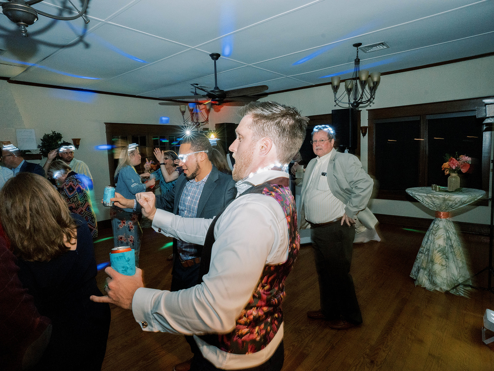 Darrick and guests dancing with light up sunglasses