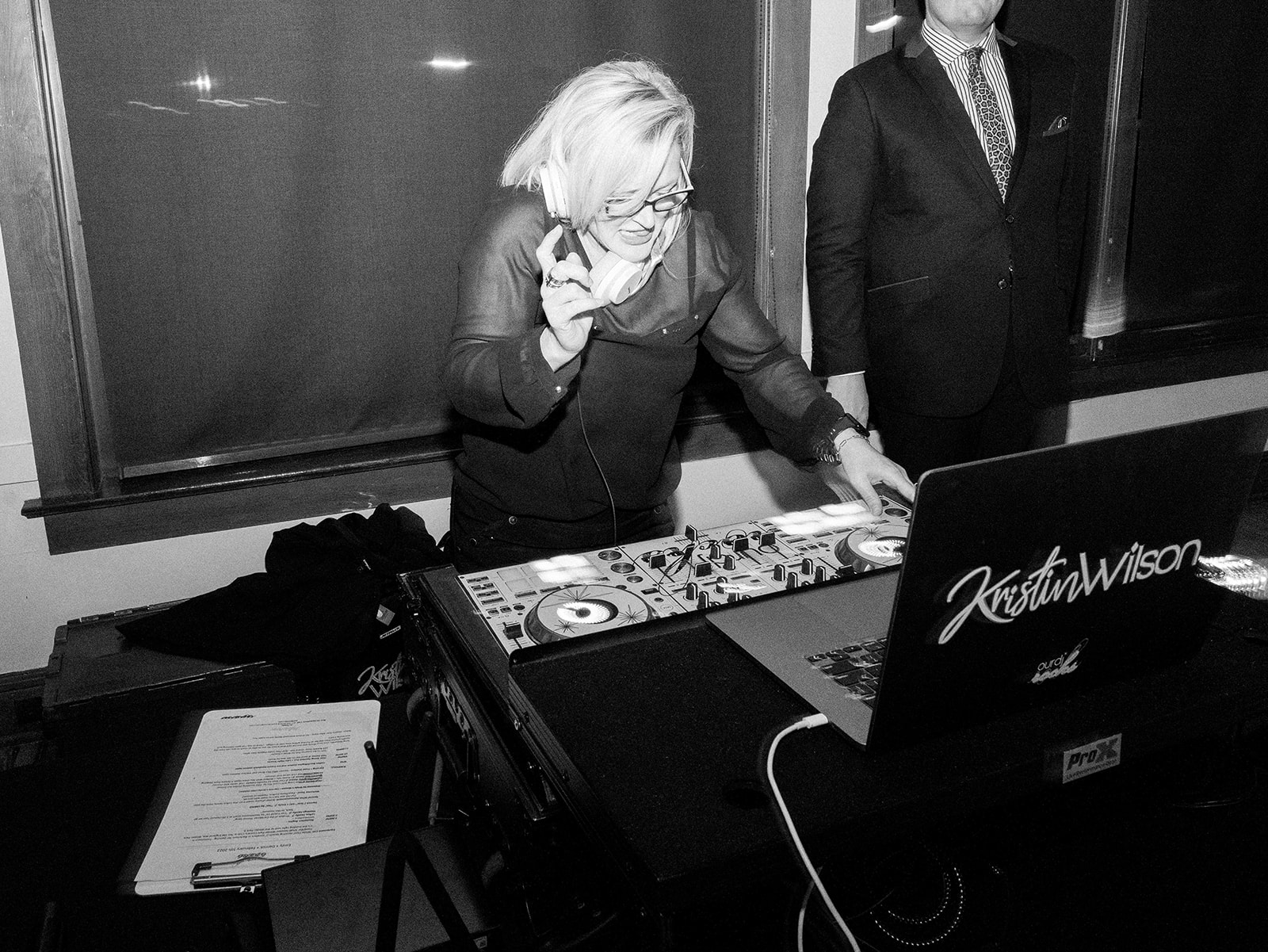 DJ Kristin behind the sound booth