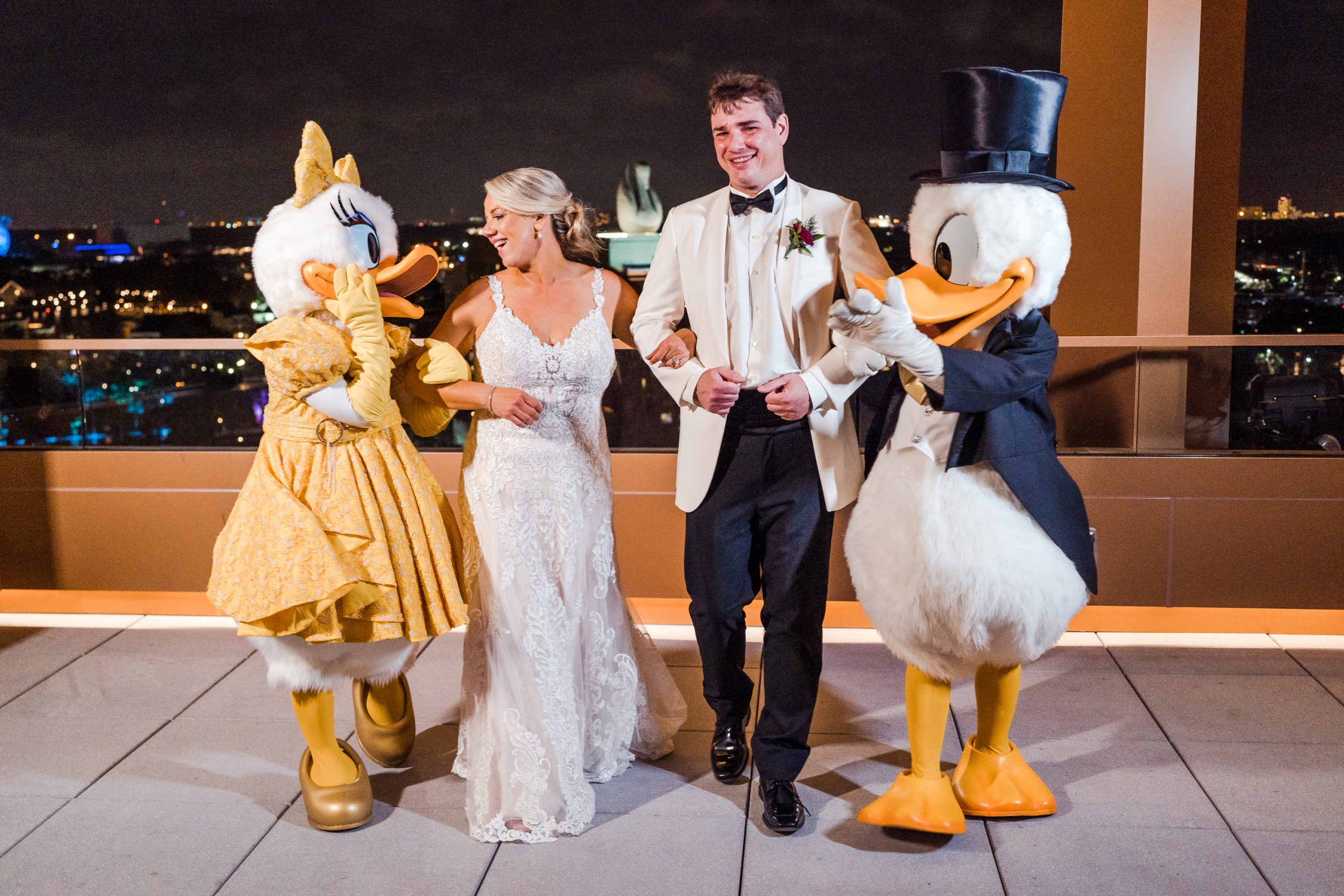 bride and groom with Donald and Daisy Duck