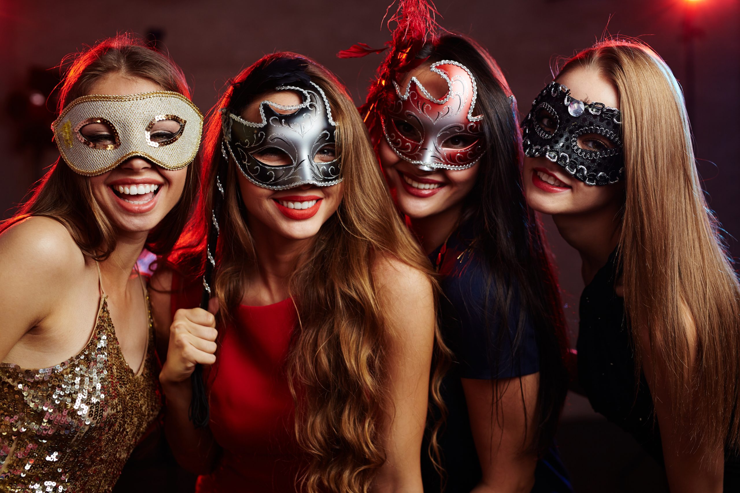 teens wearing masquerade masks at prom