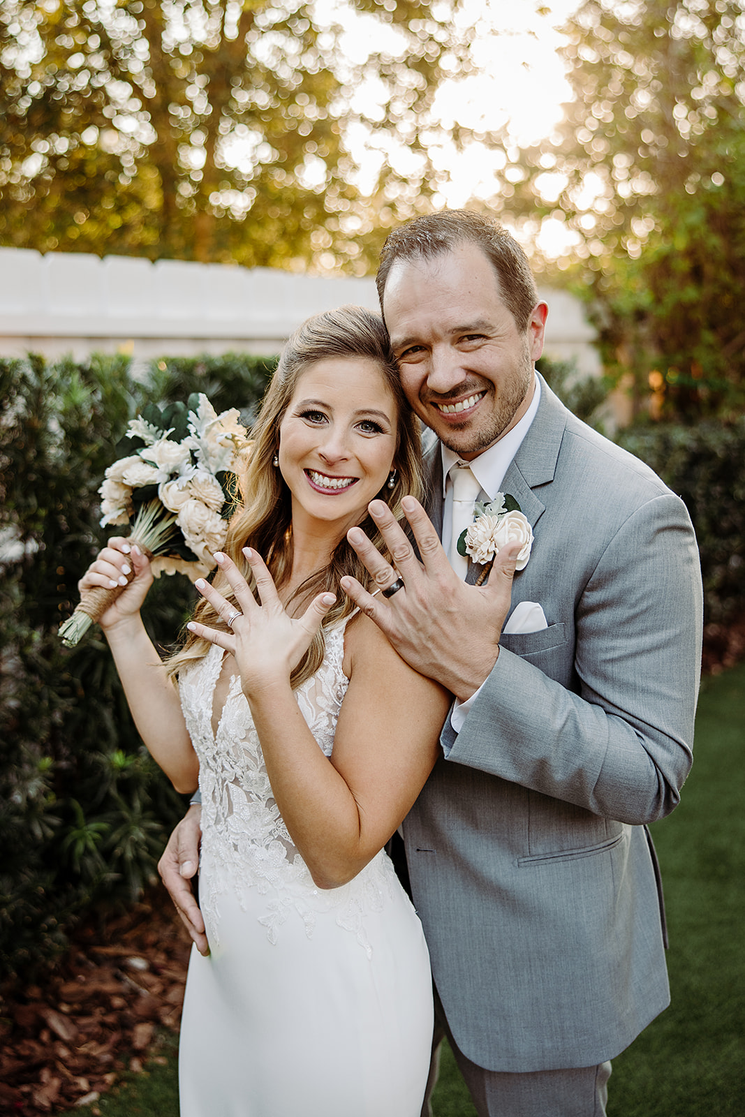 Casey and Jake showing off their rings after their wedding